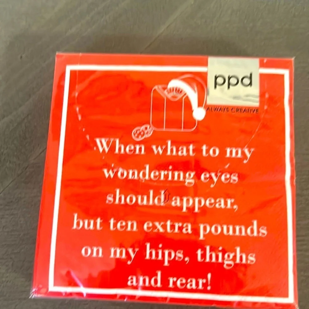 This image shows a red cocktail napkin with a humorous holiday-themed poem